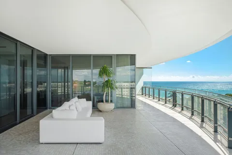 a view of a balcony with wooden floor