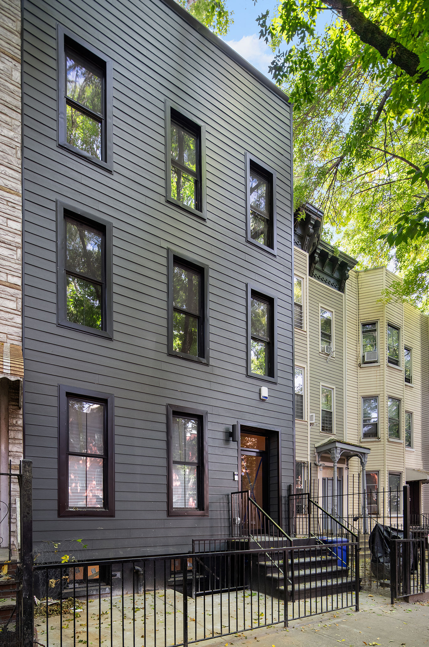 1110 Putnam Avenue, Unit 2 Brooklyn, NY 11221 - Photo 6 of 8 a front view of a house with a garden