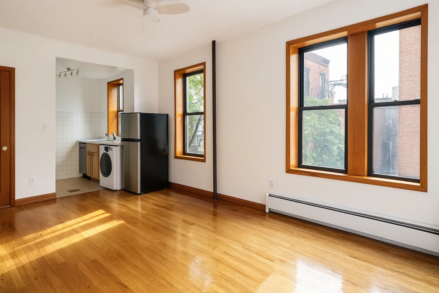 a view of livingroom with furniture wooden floor and window
