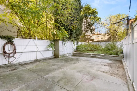 a view of backyard and tree