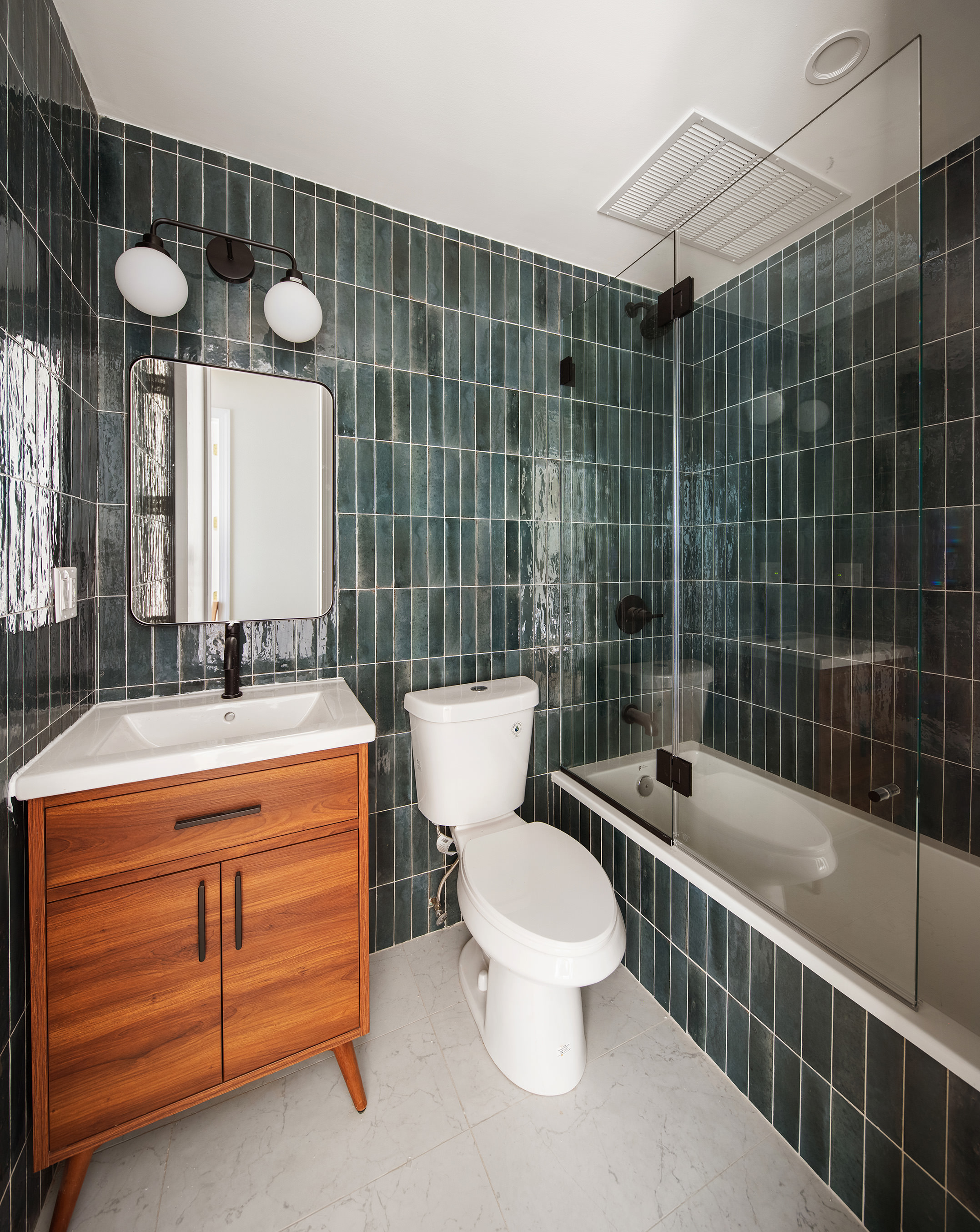 1110 Putnam Avenue, Unit 2 Brooklyn, NY 11221 - Photo 5 of 8 a bathroom with a sink a toilet and shower
