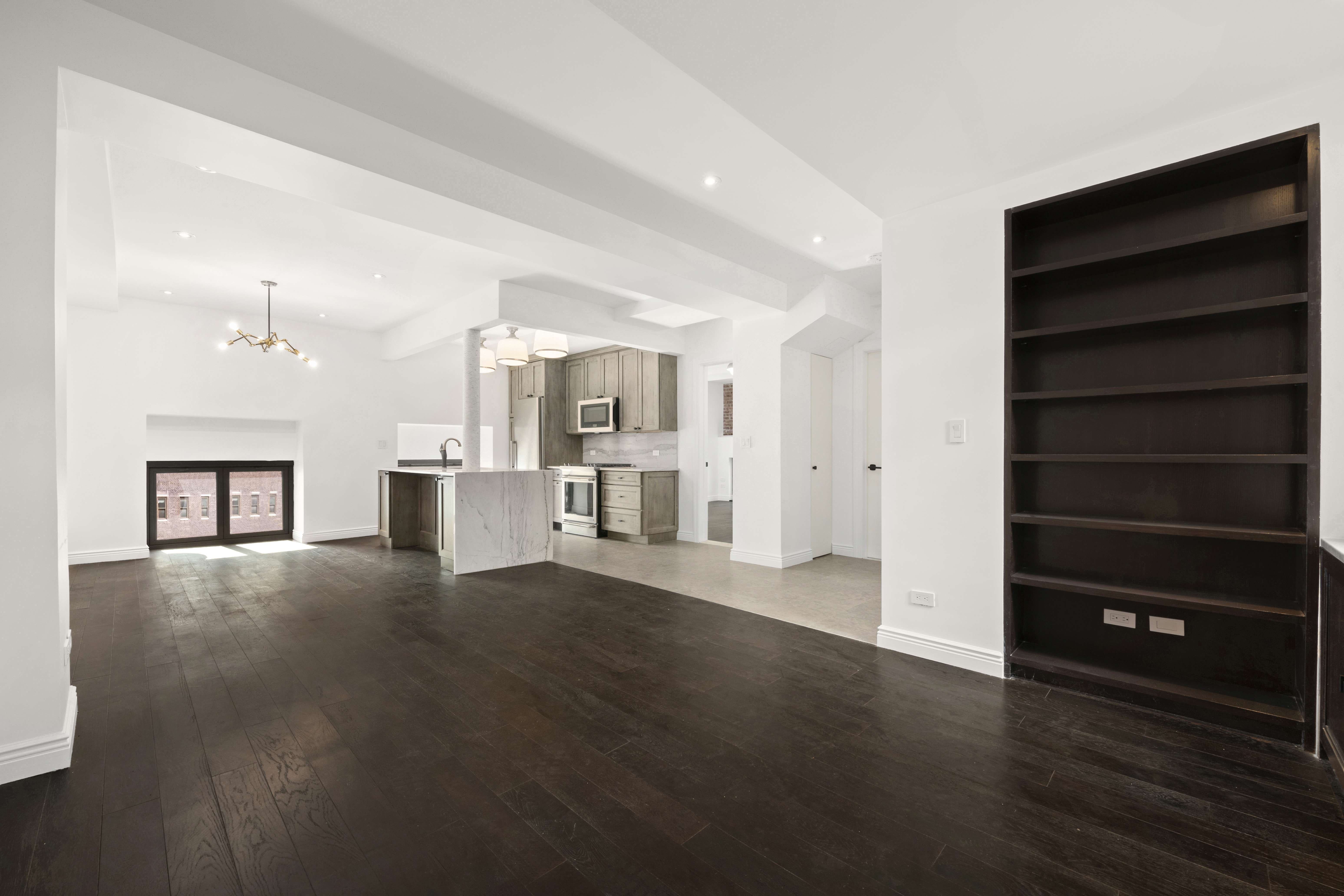 3 Hanover Square, Unit 21C Manhattan, NY 10004 - Photo 2 of 19 a view of an empty room with a cabinet and a window
