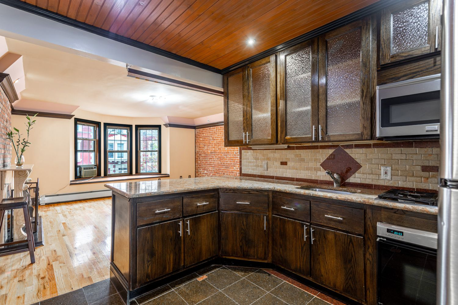 12 Virginia Place Brooklyn, NY 11213 - Photo 5 of 10 a kitchen with stainless steel appliances granite countertop a sink stove and cabinets