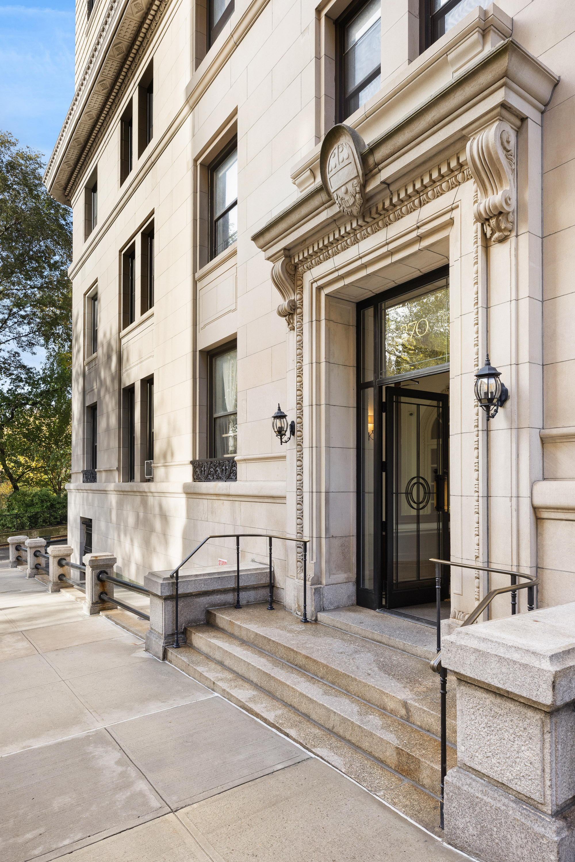 270 Riverside Drive, Unit 2C Manhattan, NY 10025 - Photo 20 of 22 a view of a building with a bench in front of building