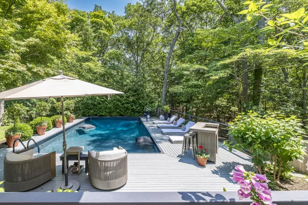 an outdoor space with furniture and umbrella