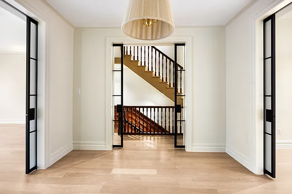 32 Prospect Park West Brooklyn, NY 11215 - Photo 8 of 21 a view of staircase with railing and a chandelier