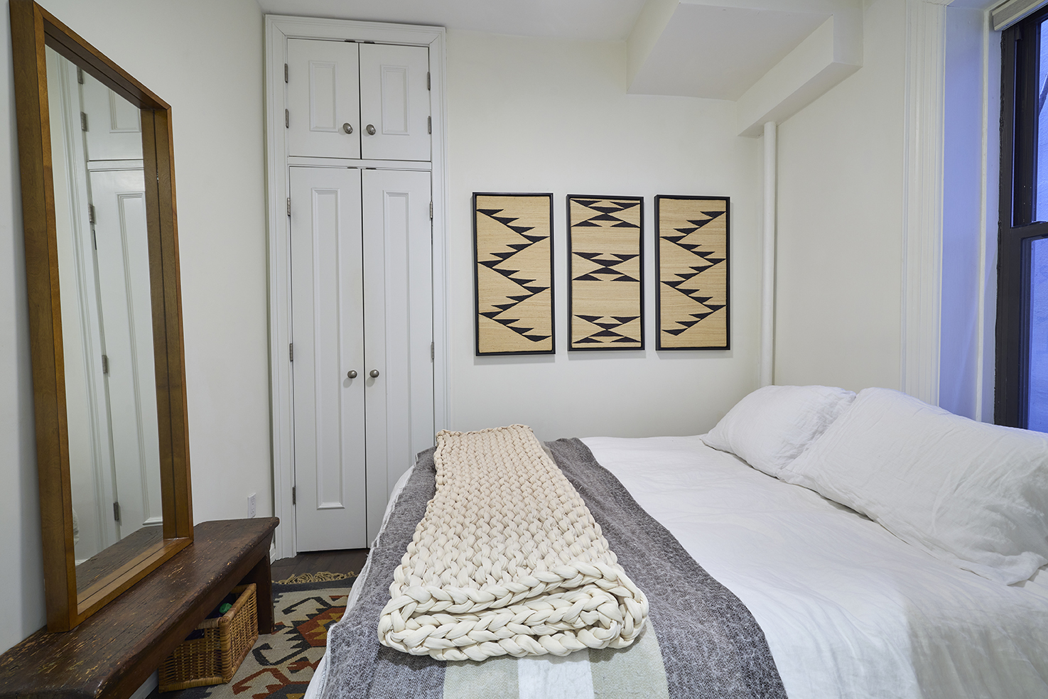 227 West 11th Street, Unit 2 Manhattan, NY 10014 - Photo 5 of 8 a bedroom with a bed and a window