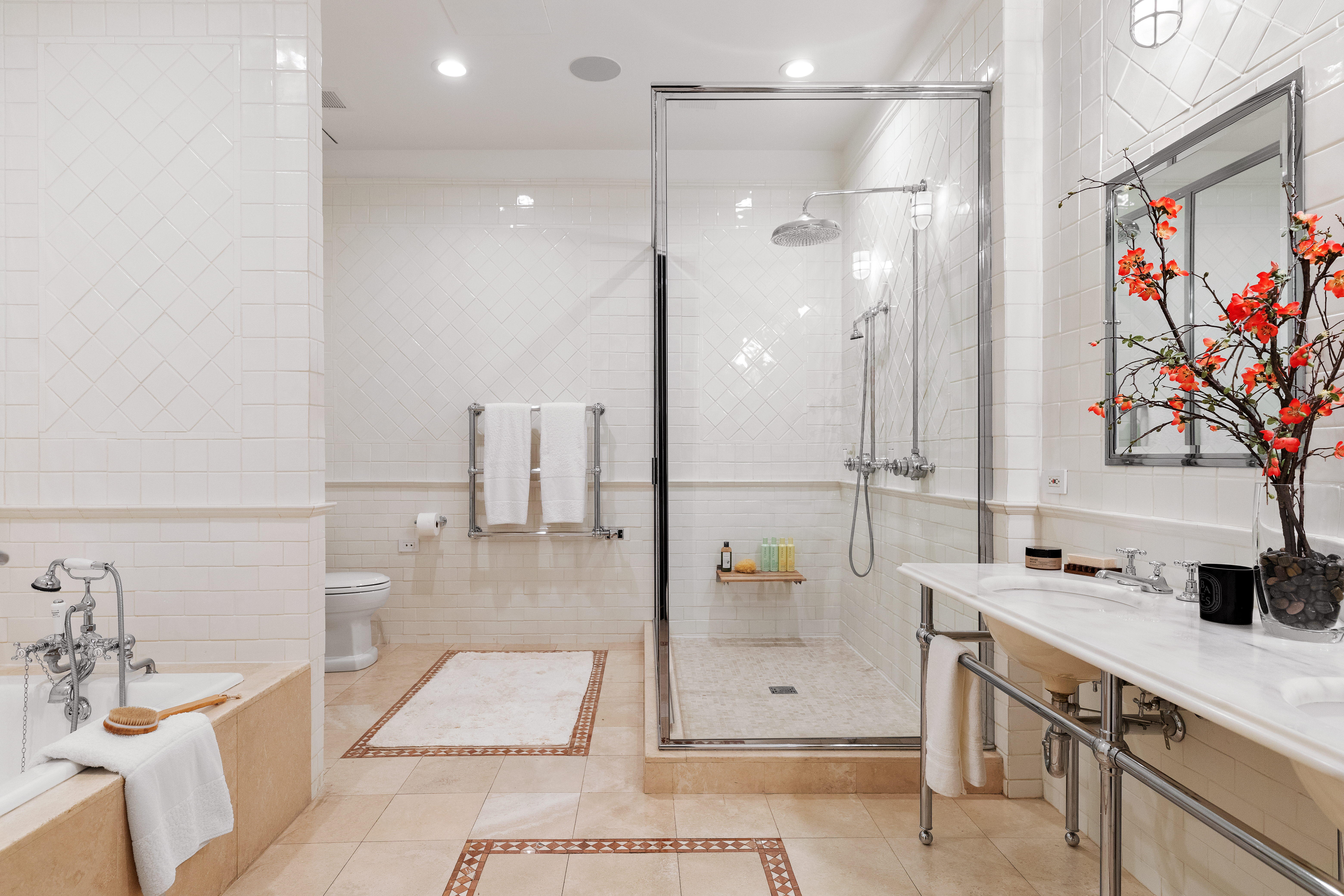 388 West Broadway, Unit 2 Manhattan, NY 10012 - Photo 17 of 27 a bathroom with a tub sink and mirror