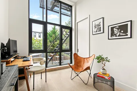 a workspace with furniture and a window