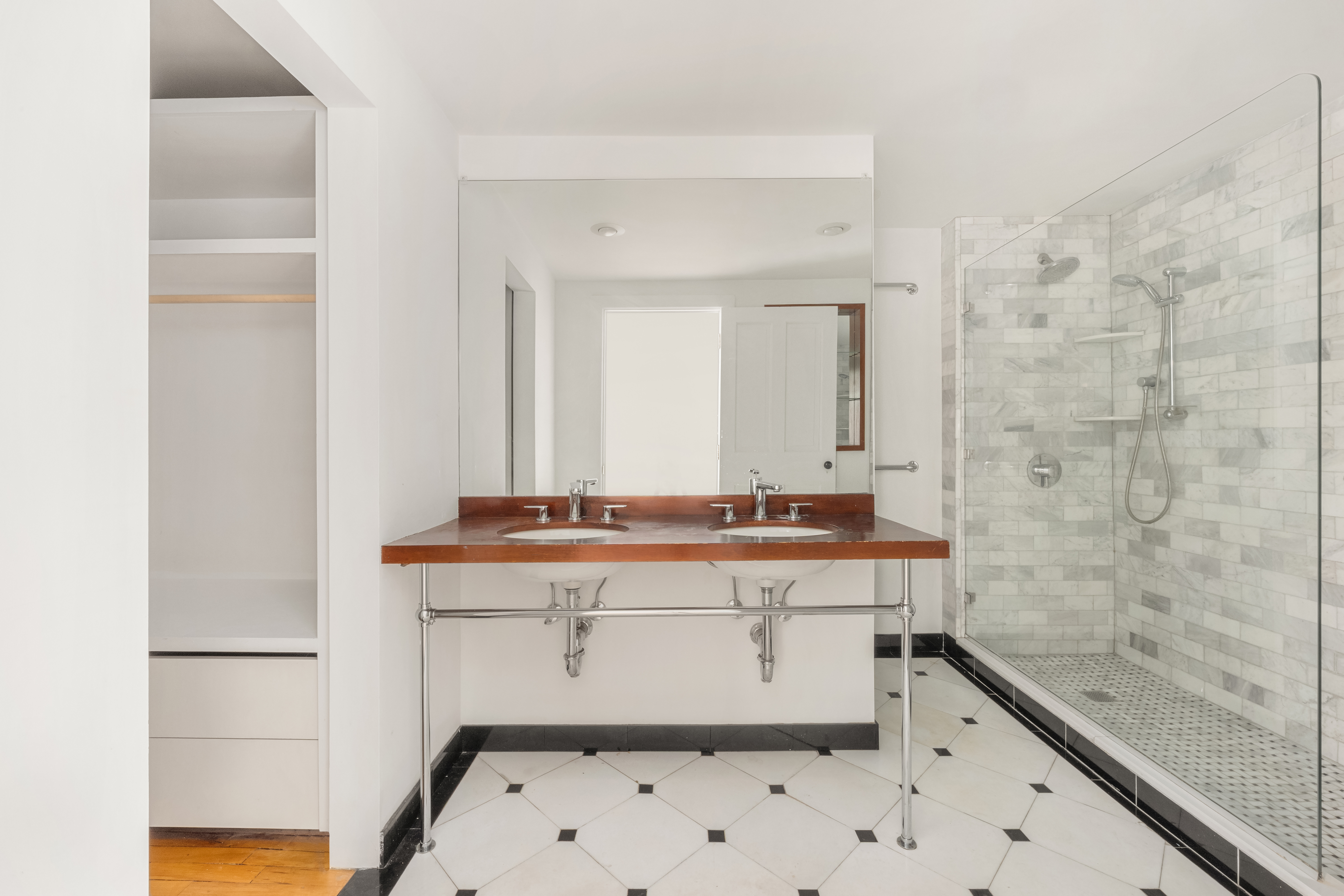 519 Broadway, Unit PHC Manhattan, NY 10012 - Photo 9 of 16 a bathroom with a sink and a mirror