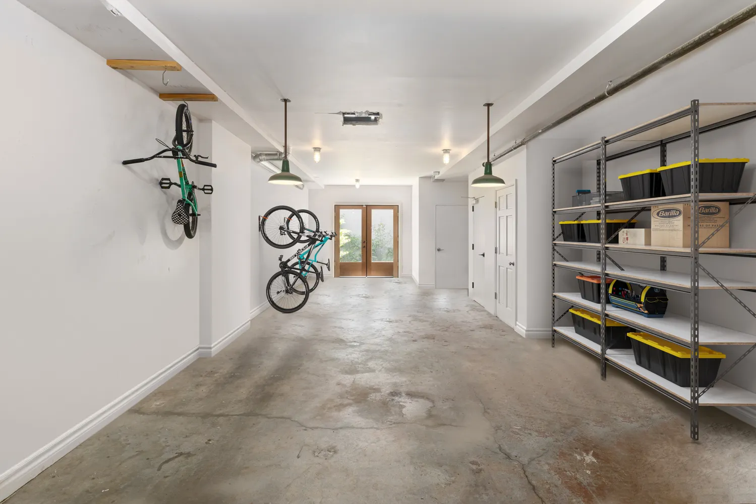a backyard with table and chairs with potted plants