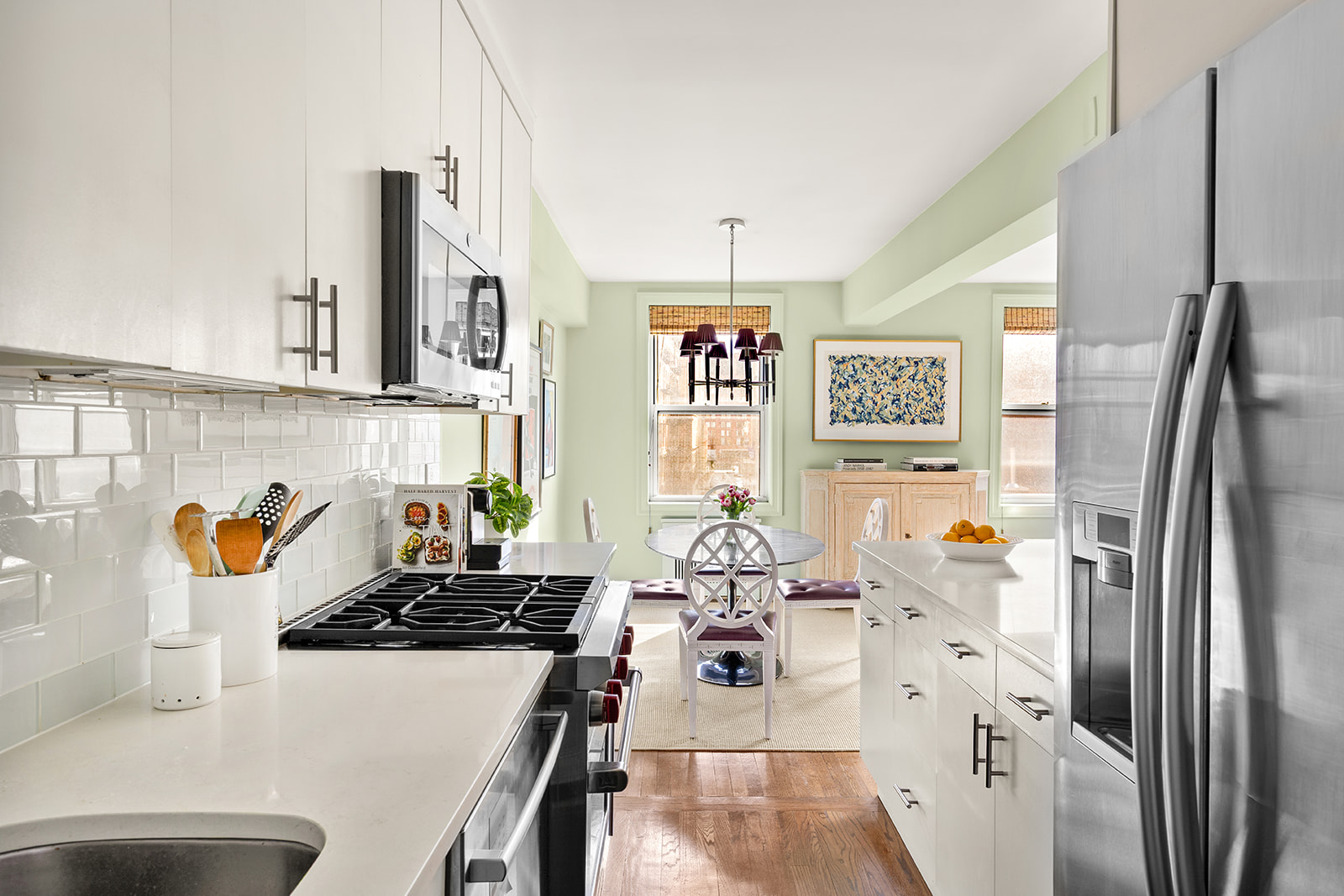 30 East 9th Street, Unit 5LL Manhattan, NY 10003 - Photo 4 of 10 a kitchen with stainless steel appliances a refrigerator a stove a sink and a refrigerator