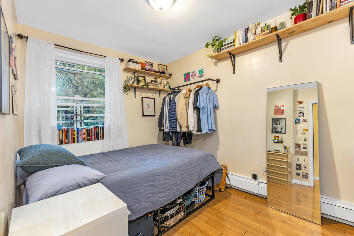 539 Quincy Street Brooklyn, NY 11221 - Photo 9 of 15 a bedroom with a bed and a window