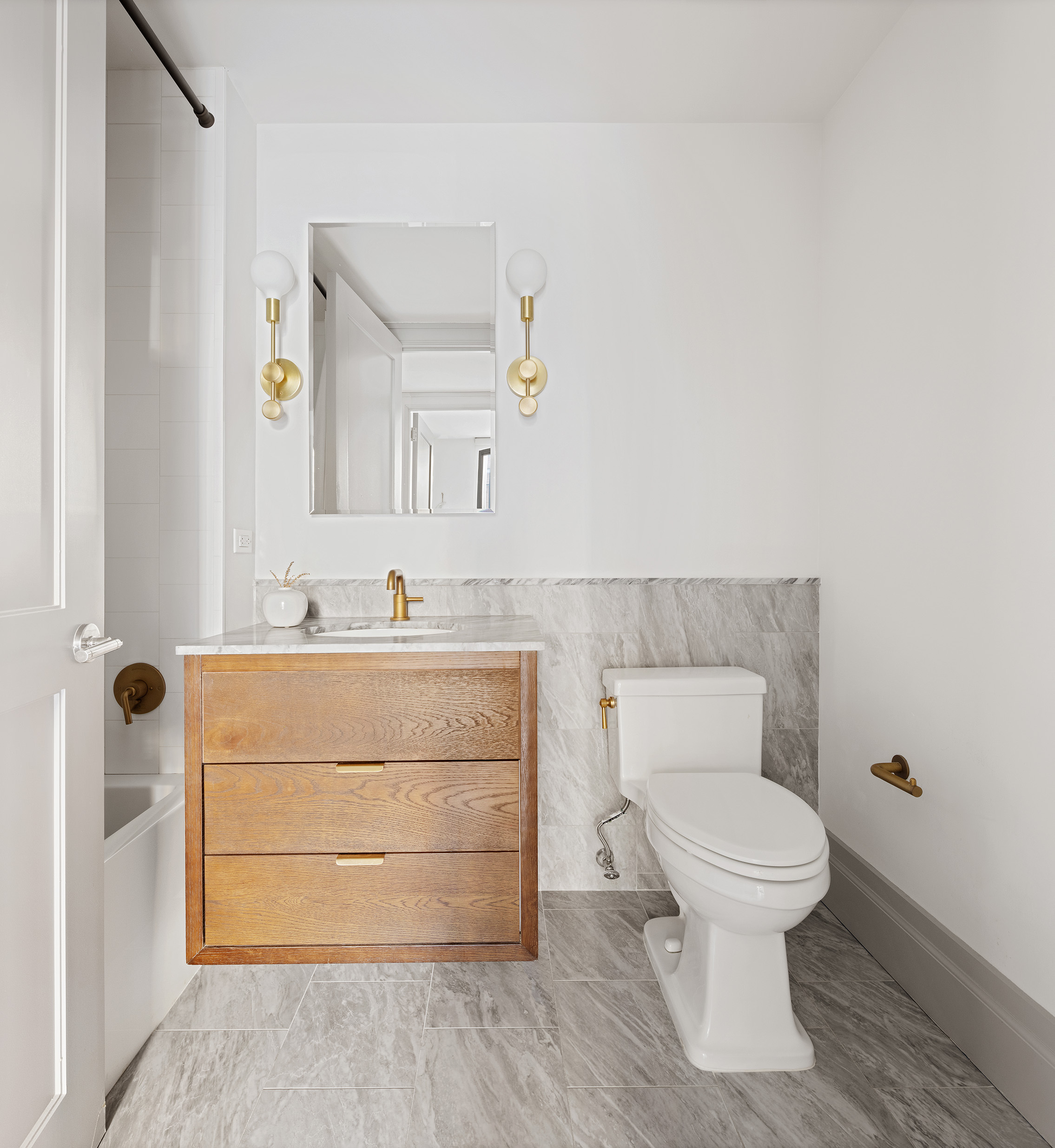 76 Schermerhorn Street, Unit 2C Brooklyn, NY 11201 - Photo 8 of 16 a bathroom with a toilet sink and mirror