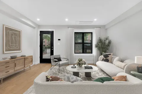 a living room with furniture and window