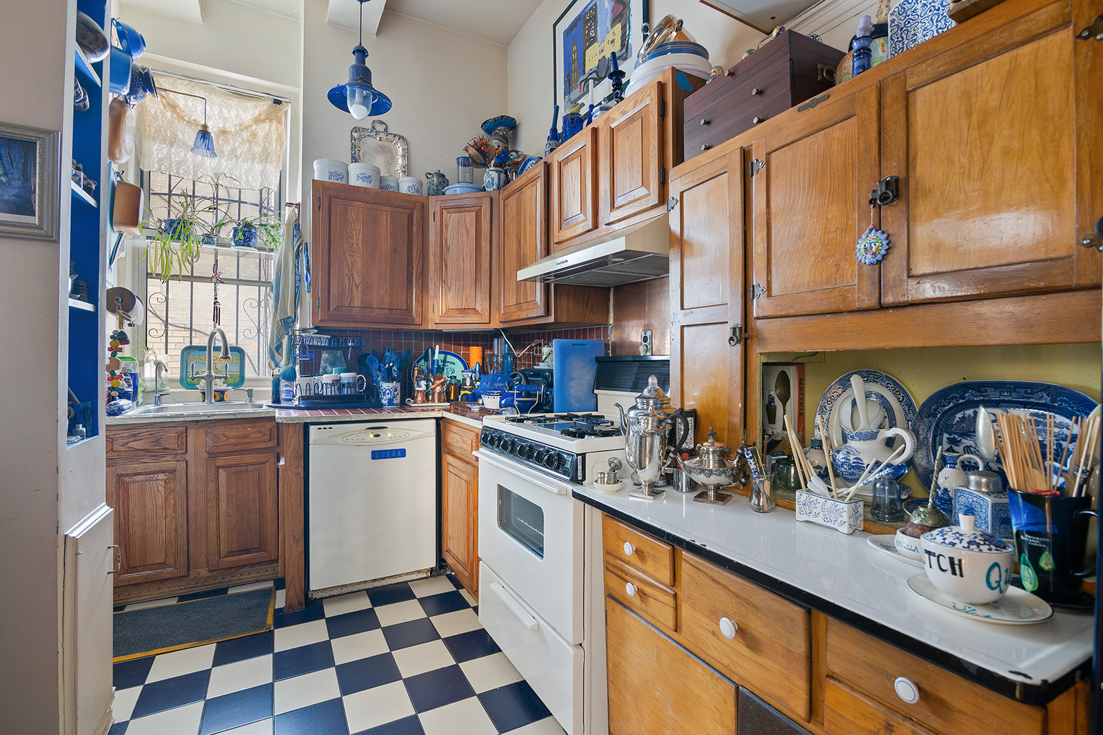 41 Eastern Parkway, Unit 1D Brooklyn, NY 11238 - Photo 6 of 16 a kitchen with stainless steel appliances granite countertop a stove a sink and a microwave