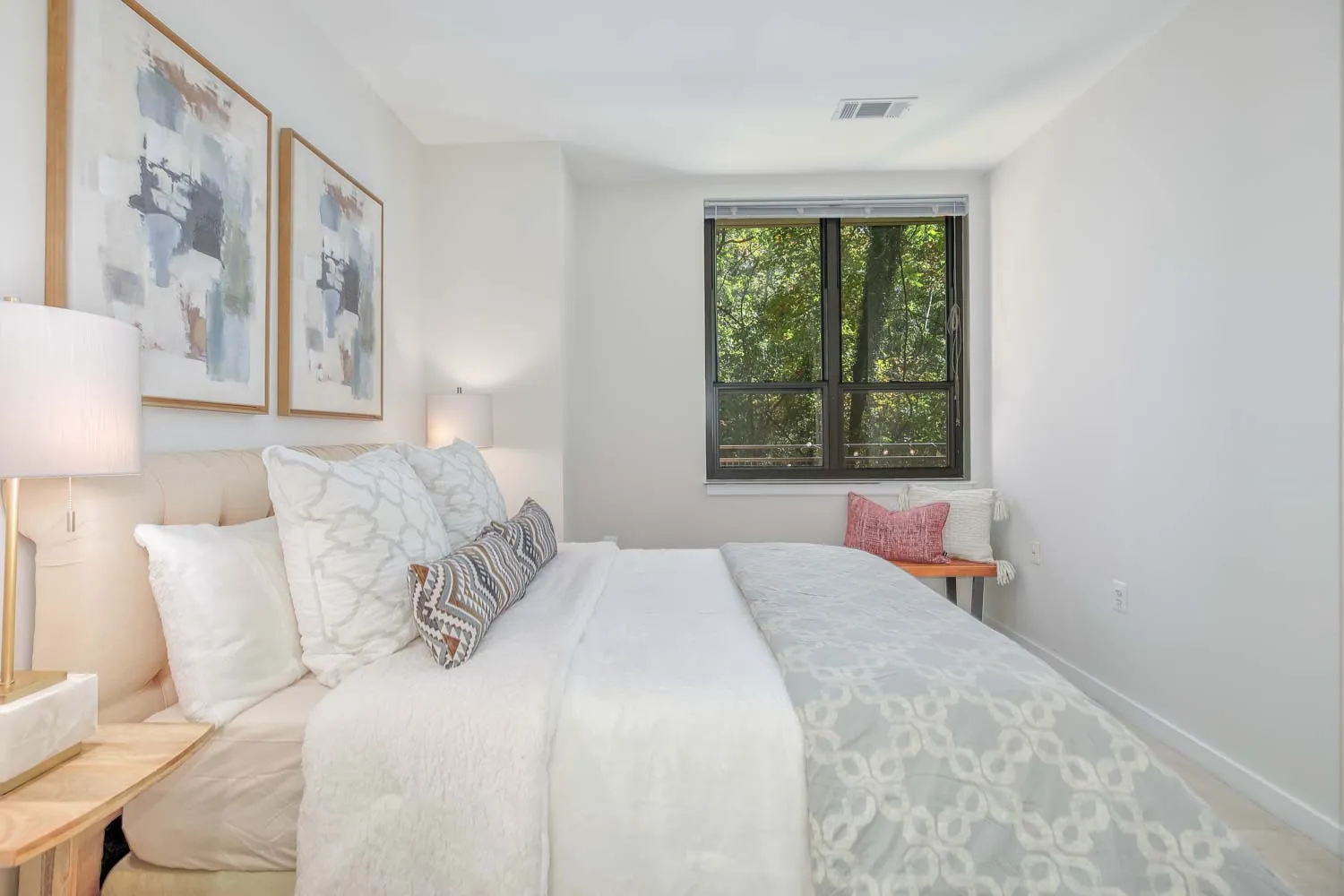 a bedroom with a large bed and a window