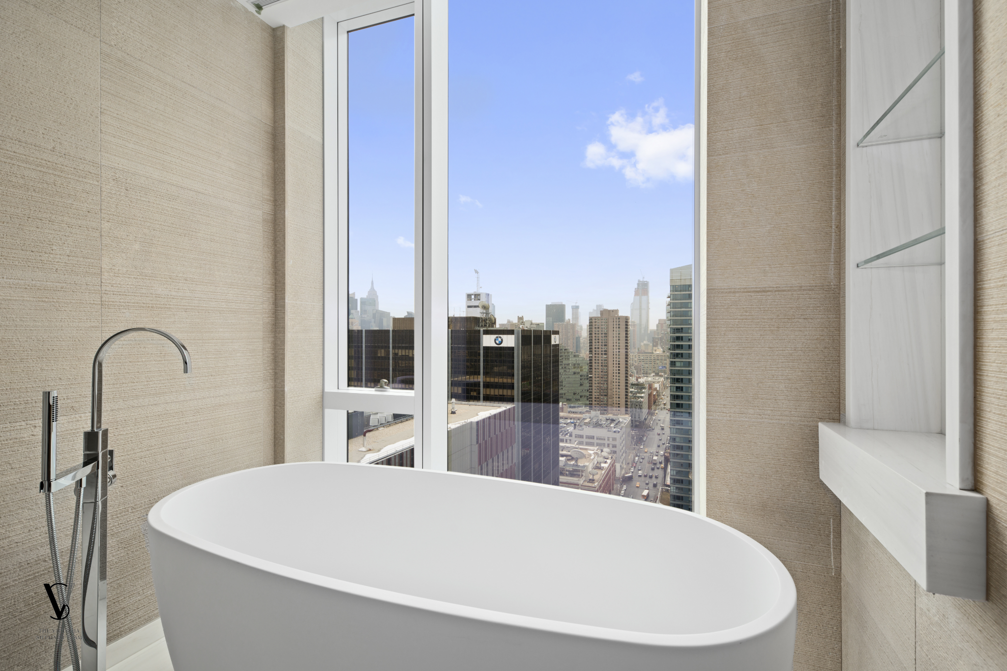 1 West End Avenue, Unit 28C Manhattan, NY 10023 - Photo 6 of 26 a large white tub sitting in a bathroom