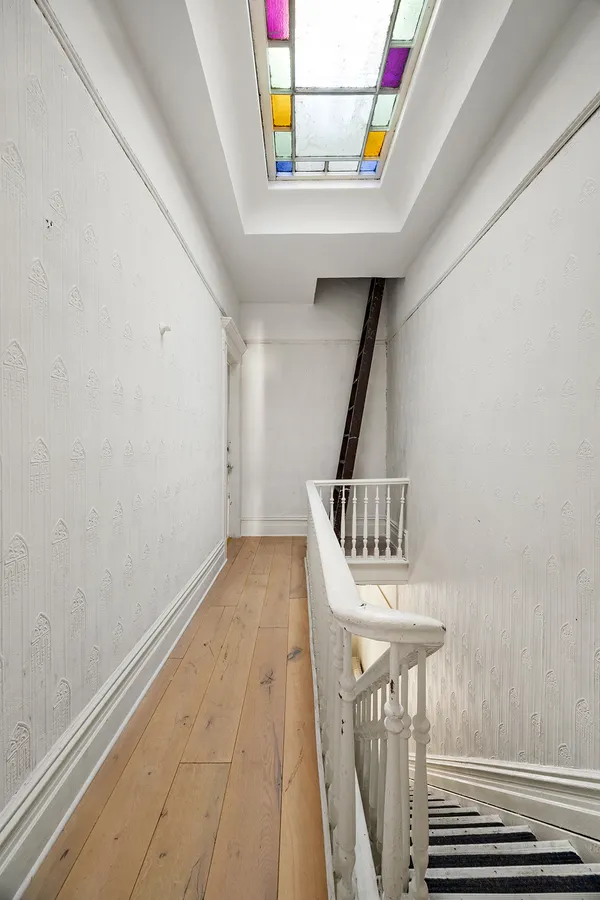 a view of entryway with wooden floor