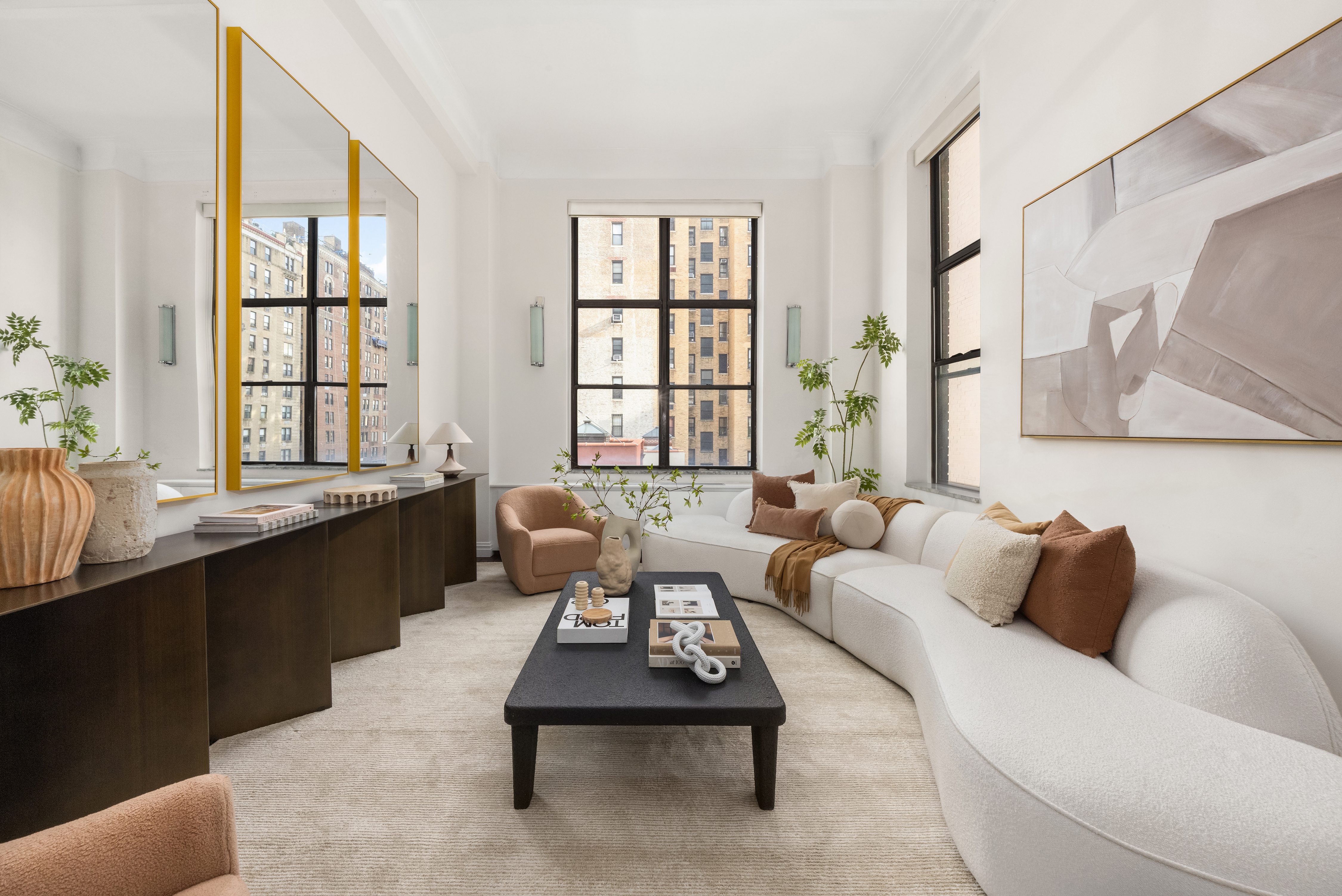 49 East 96th Street, Unit 9B Manhattan, NY 10128 - Photo 3 of 15 a living room with furniture and a large window