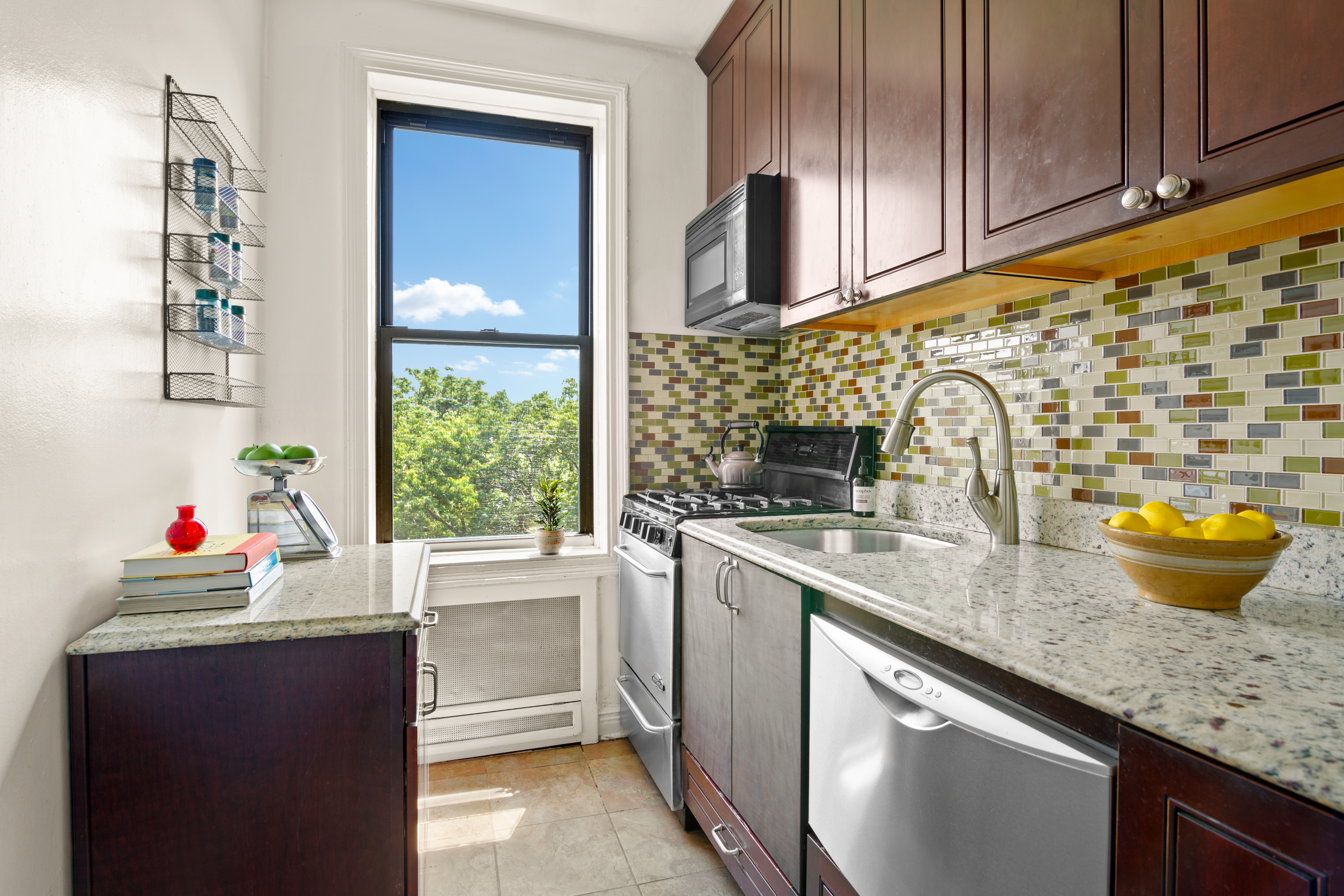 1710 Avenue H, Unit D6 Brooklyn, NY 11230 - Photo 3 of 9 a kitchen with a sink cabinets and window