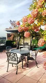 a view of a tables and chairs in patio