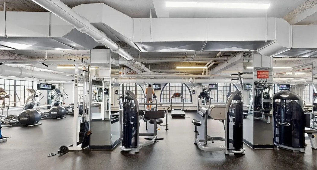 5 Tudor City Place, Unit 811 Manhattan, NY 10017 - Photo 12 of 14 a view of a room with gym equipment