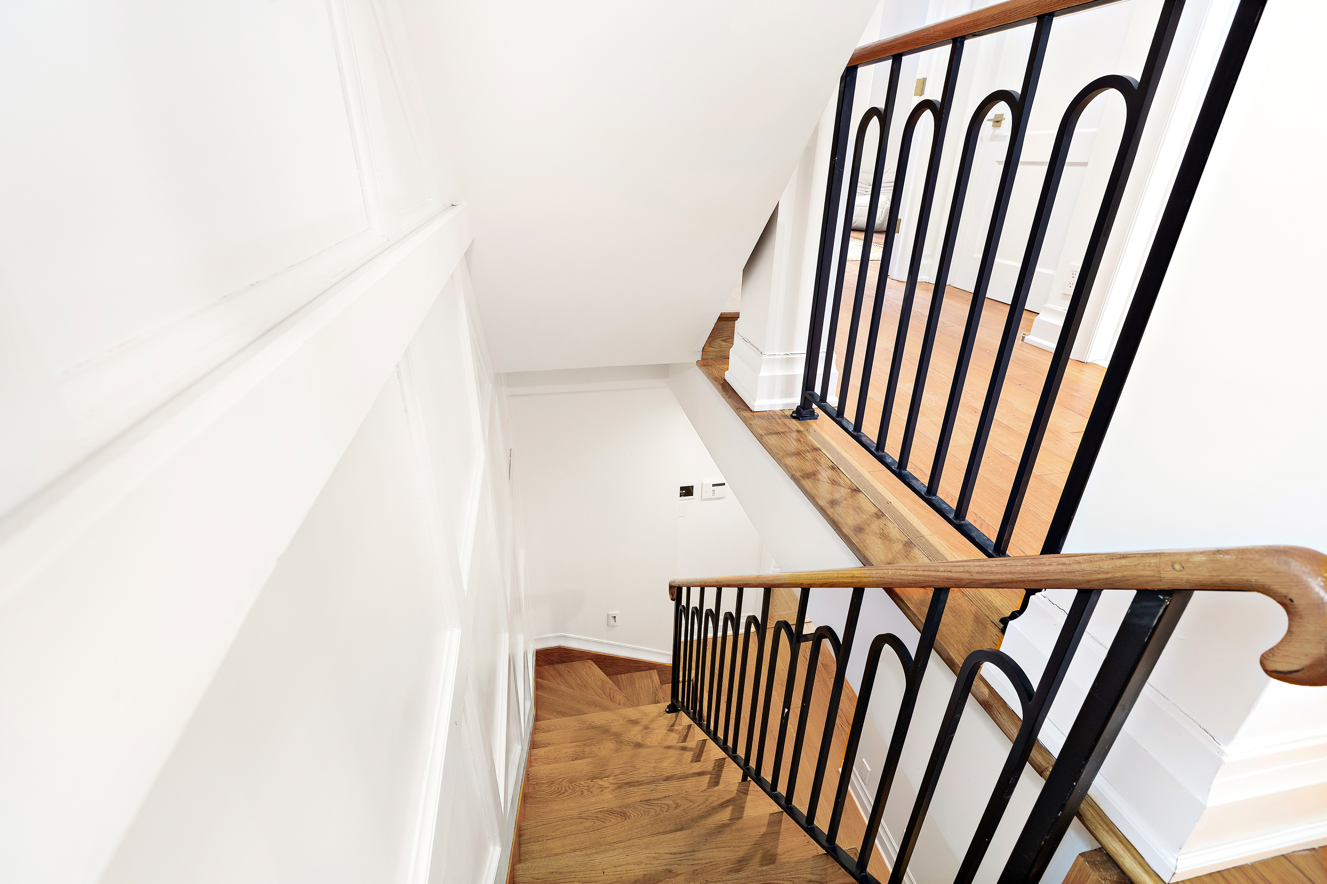 134 East 36th Street Manhattan, NY 10016 - Photo 10 of 28 a view of staircase with wooden floor