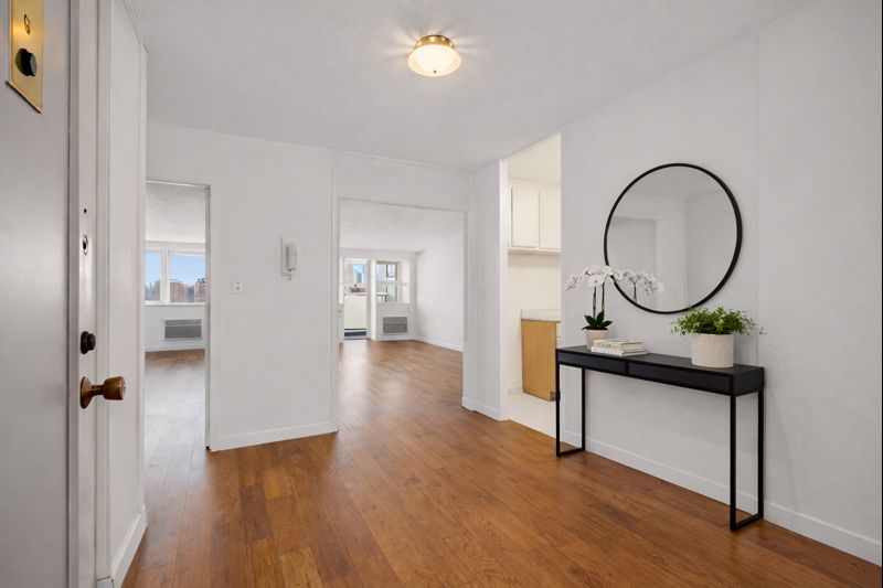 75 Henry Street, Unit 9G Brooklyn, NY 11201 - Photo 8 of 13 a view of a hallway with wooden floor and entryway