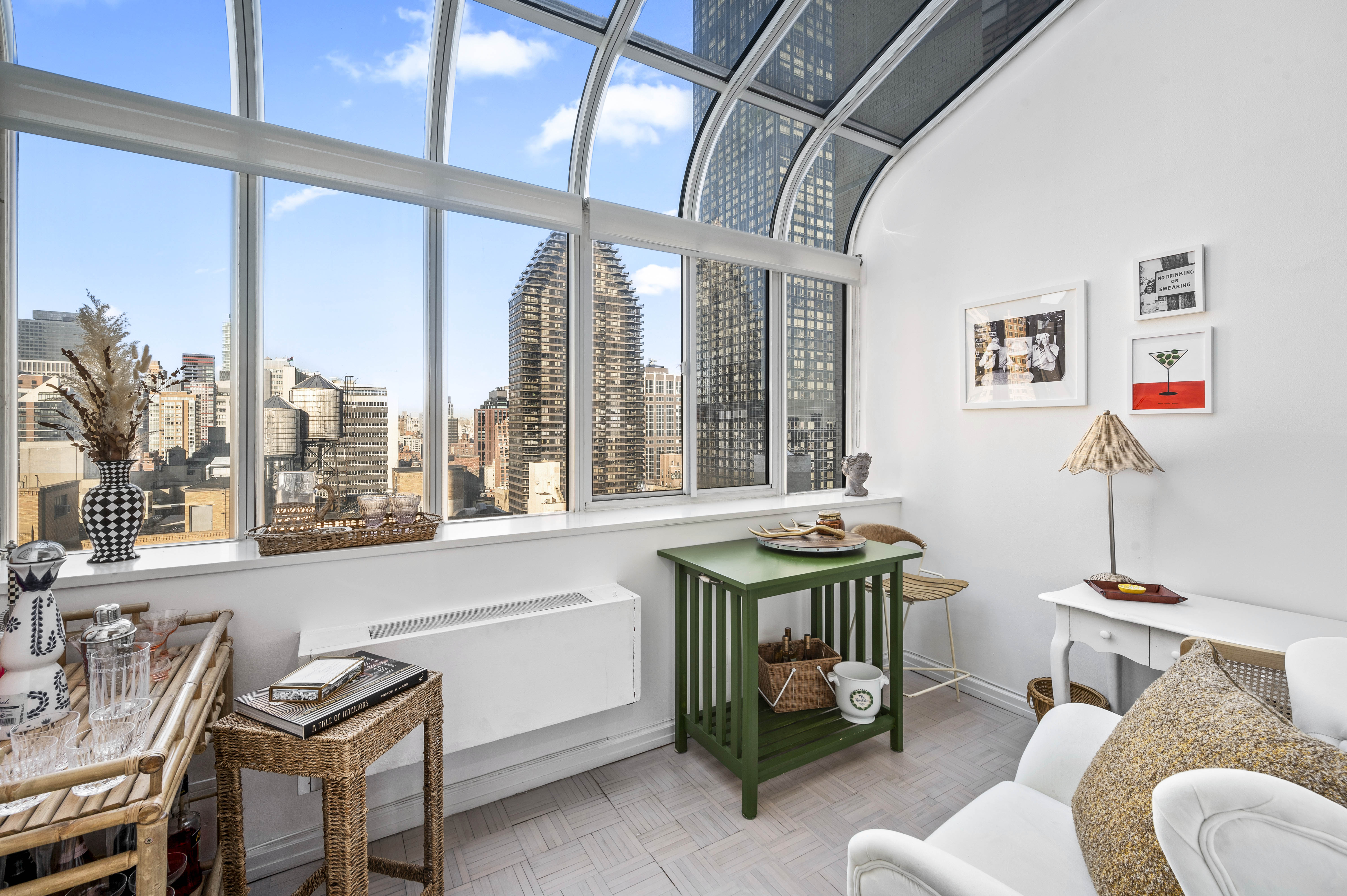 310 East 46th Street, Unit 19F Manhattan, NY 10017 - Photo 3 of 17 a room with furniture and a window