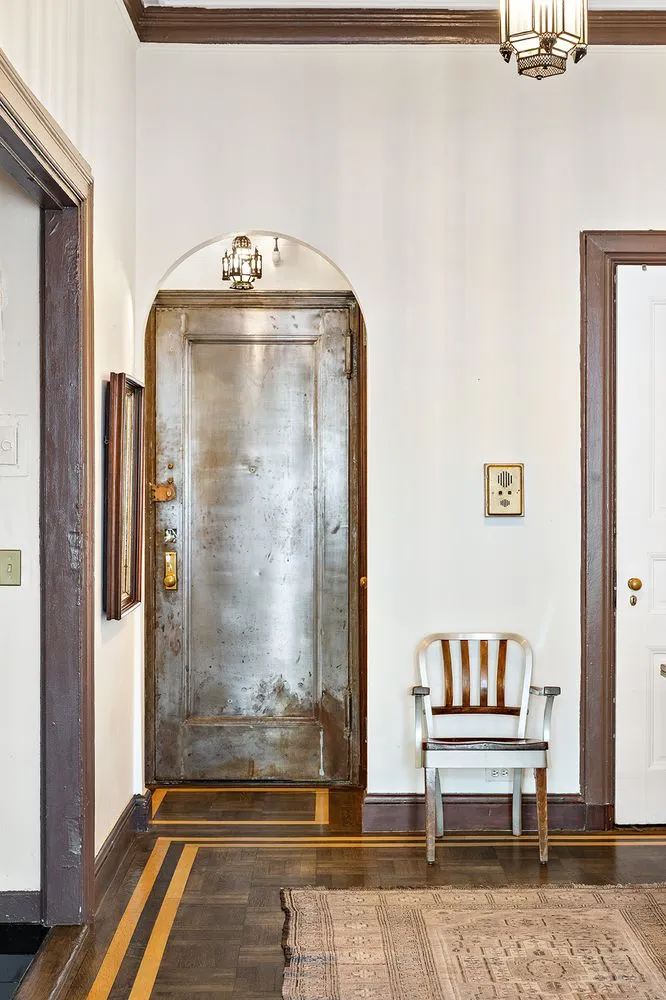 a view of front door with wooden floor