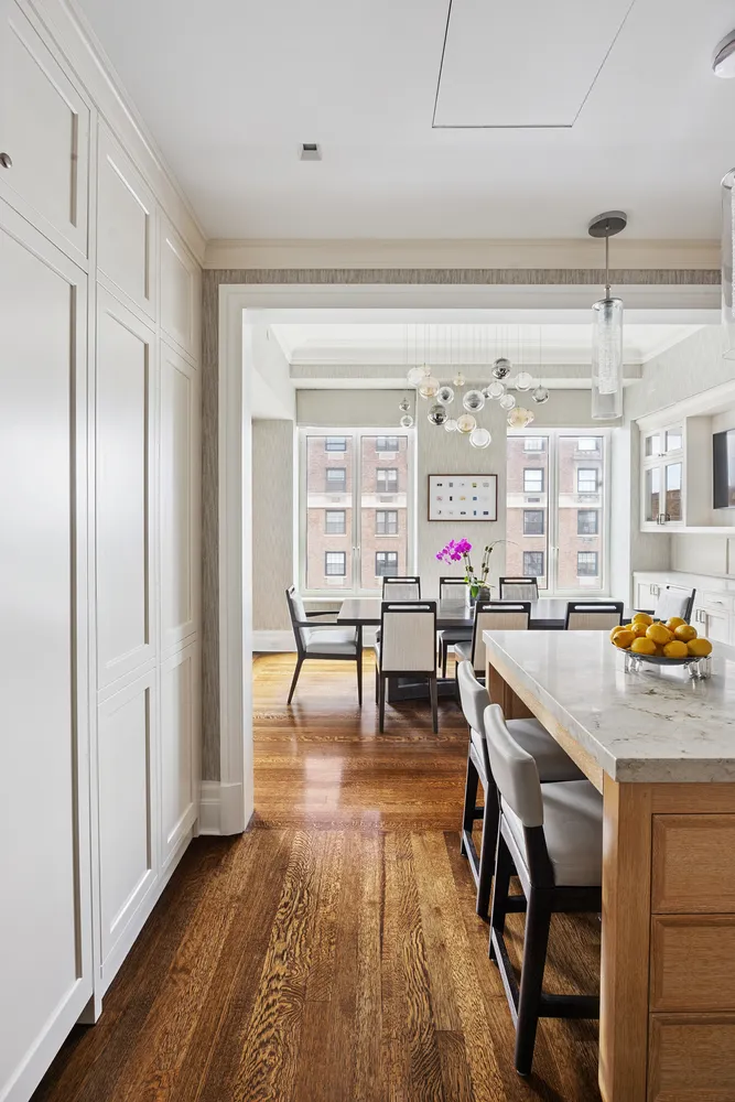 a room with dining table and chairs