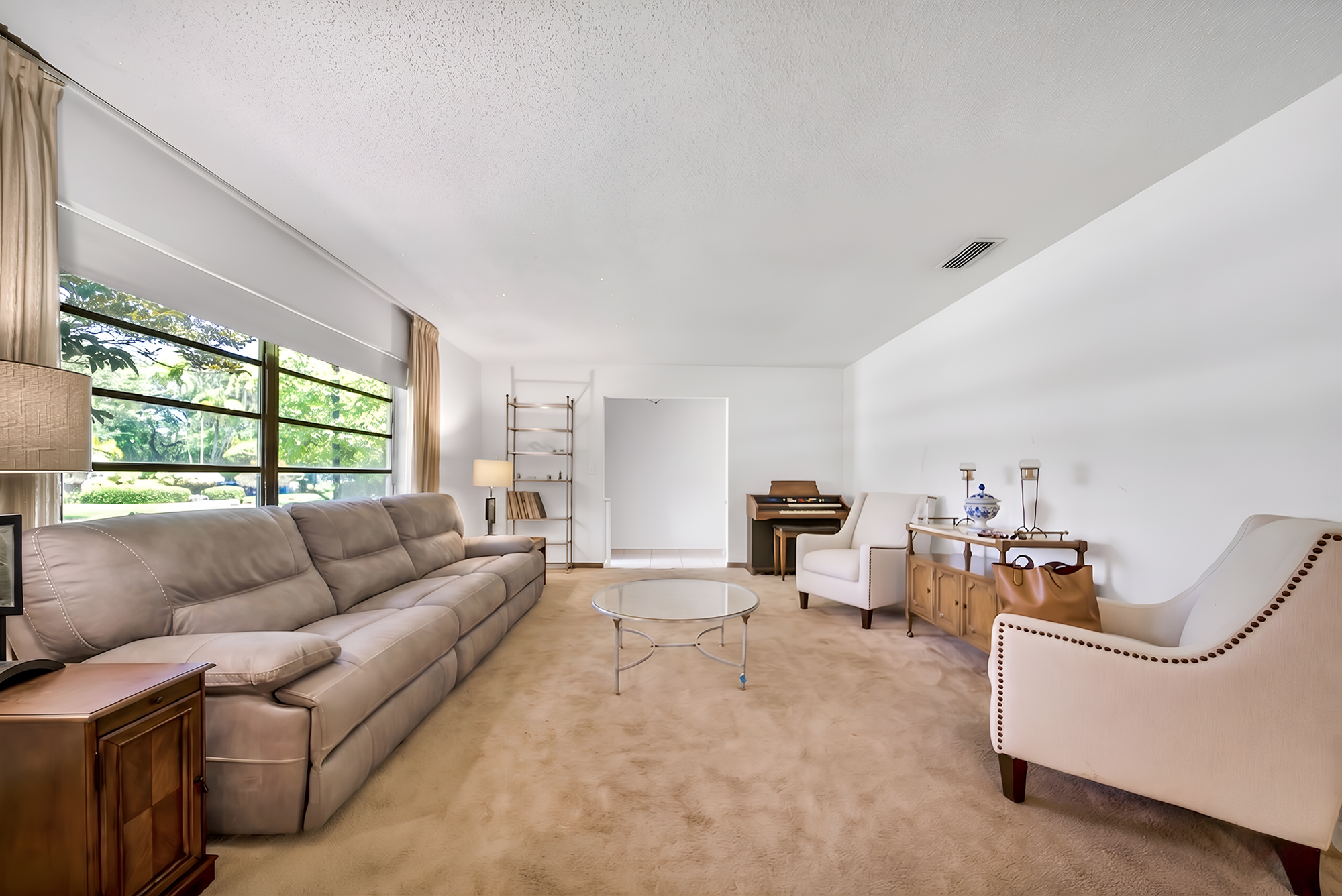 6760 Southwest 62nd Terrace Miami, FL 33143 - Photo 22 of 38 a living room with furniture and a large window