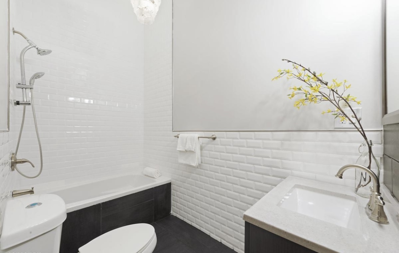 290 Hancock Street, Unit 1 Brooklyn, NY 11216 - Photo 5 of 6 a bathroom with a sink a toilet and shower