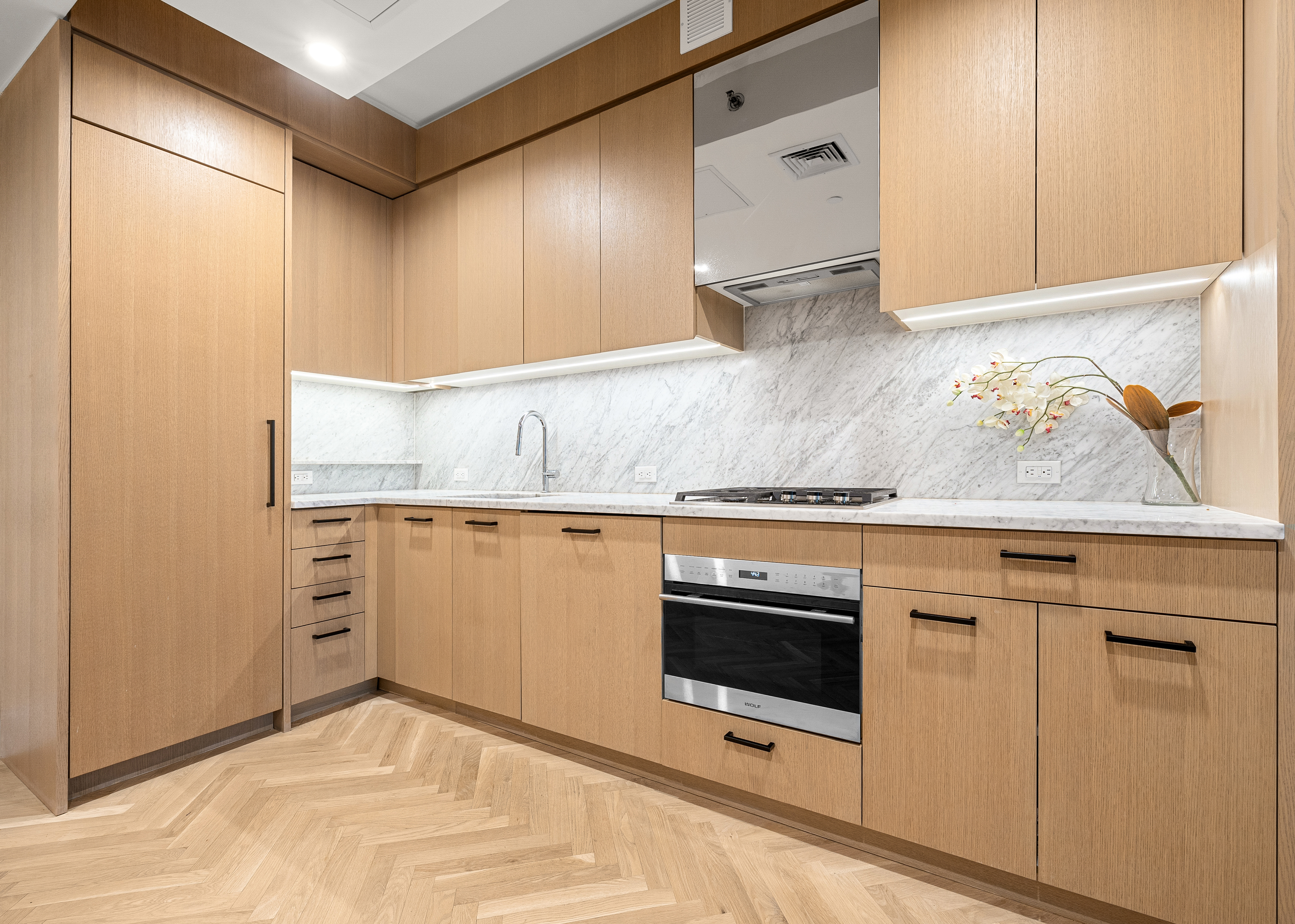 300 West 122nd Street, Unit 4F Manhattan, NY 10027 - Photo 5 of 32 a kitchen with granite countertop cabinets stainless steel appliances and a counter space
