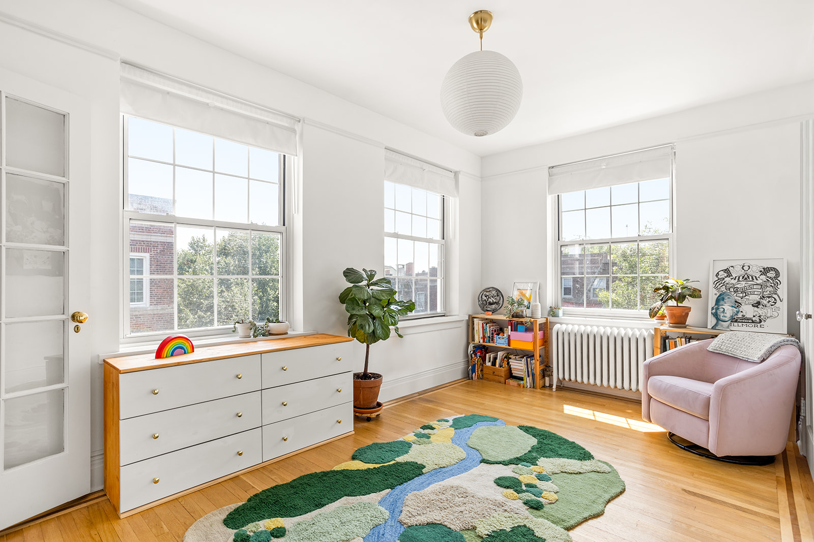 35-14 77th Street, Unit 52 Queens, NY 11372 - Photo 5 of 11 a bed room with furniture and a window