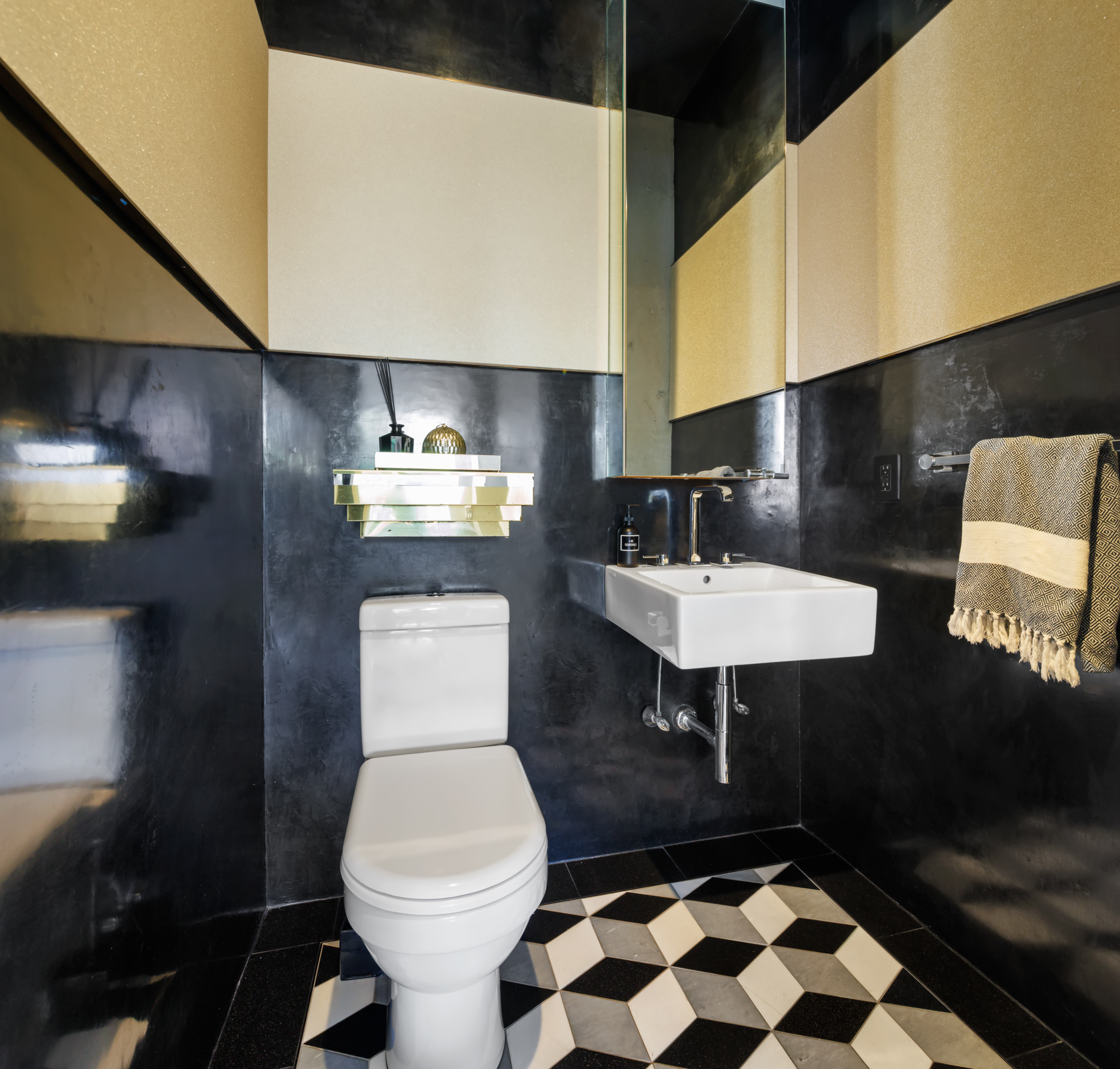 471 Washington Street, Unit 1B Manhattan, NY 10013 - Photo 16 of 17 a bathroom with a sink a toilet and a mirror