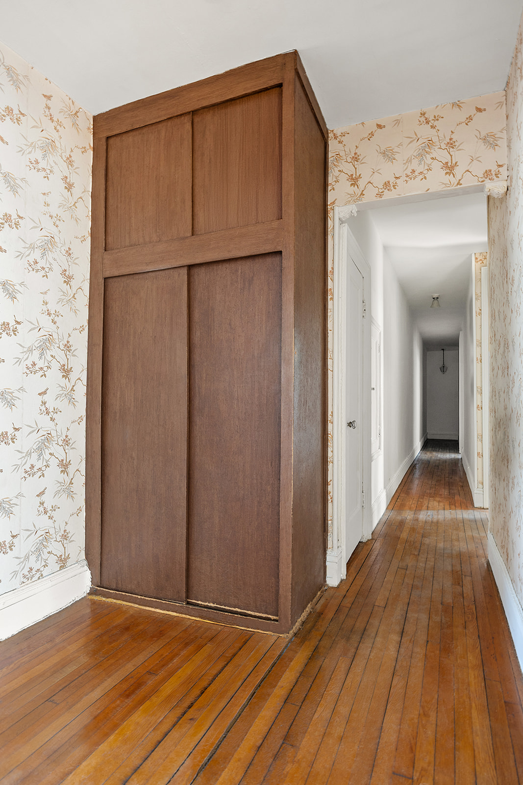 310 Windsor Place, Unit 32 Brooklyn, NY 11218 - Photo 14 of 19 a view of a room with wooden floor and a hallway