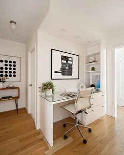 a workspace with furniture and window