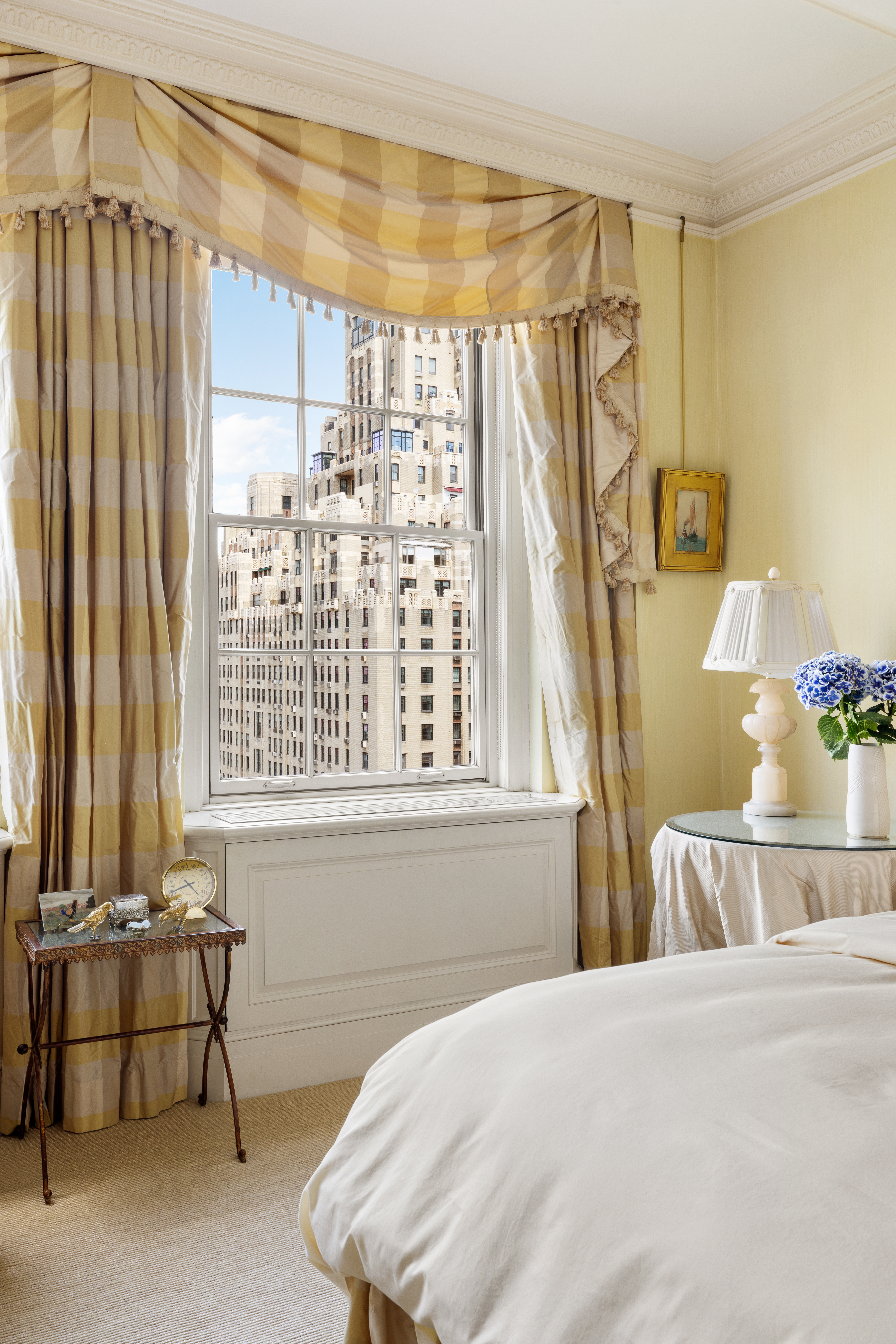 14 East 75th Street, Unit 10C Manhattan, NY 10021 - Photo 4 of 16 a bedroom with a bed and a window