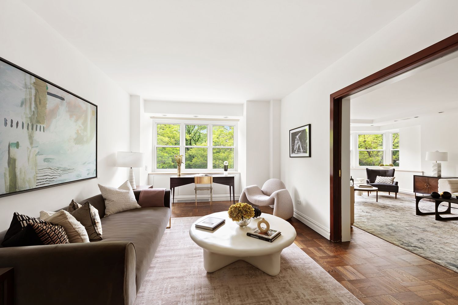 900 5th Avenue, Unit 4B Manhattan, NY 10021 - Photo 2 of 14 a living room with furniture and a large window