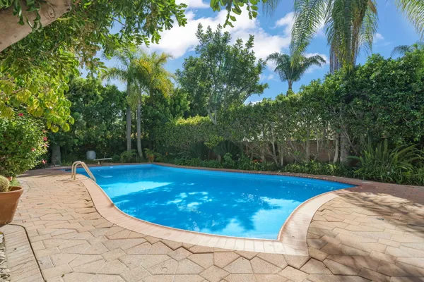 a view of a backyard with a sitting area