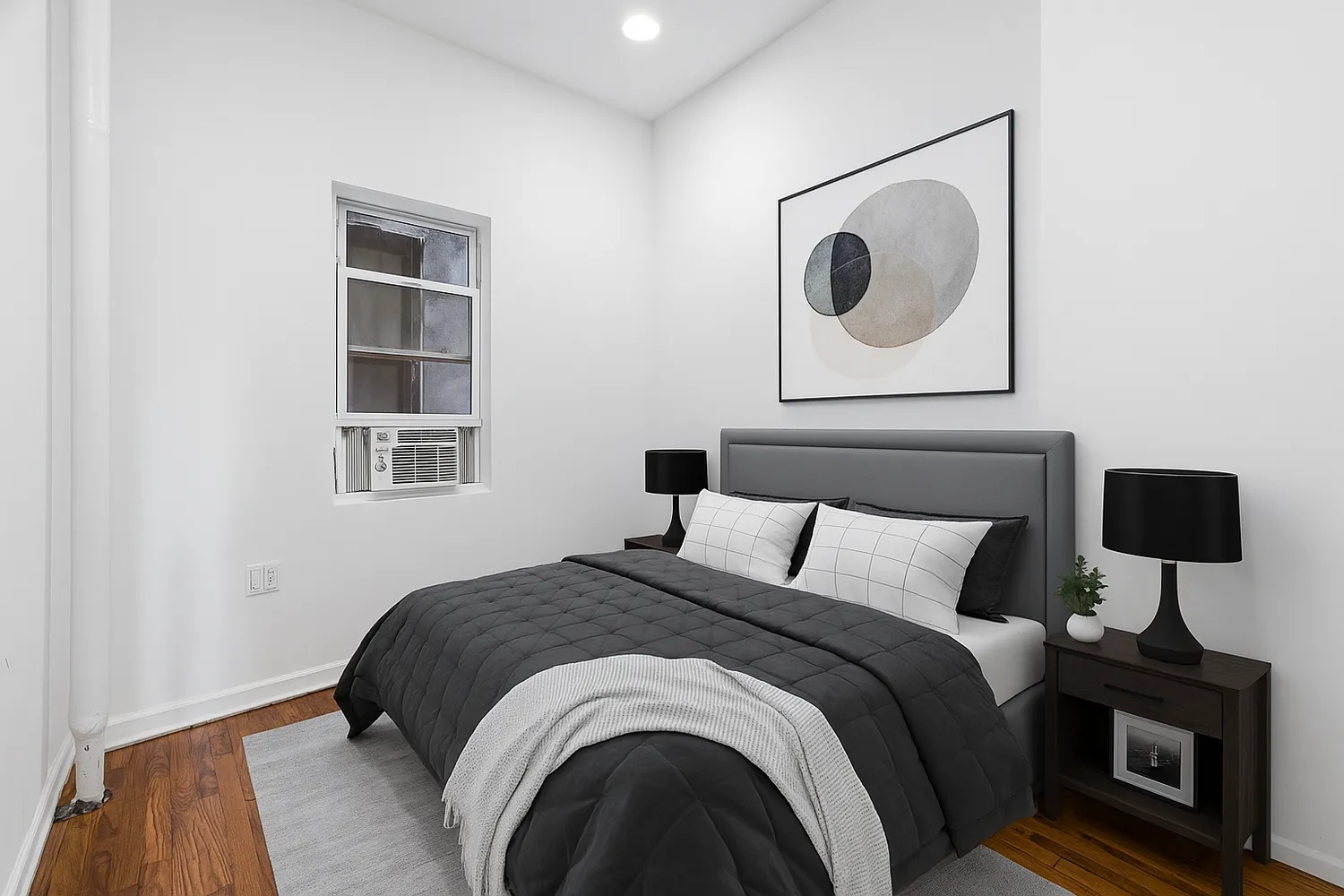 a bedroom with a bed and a window