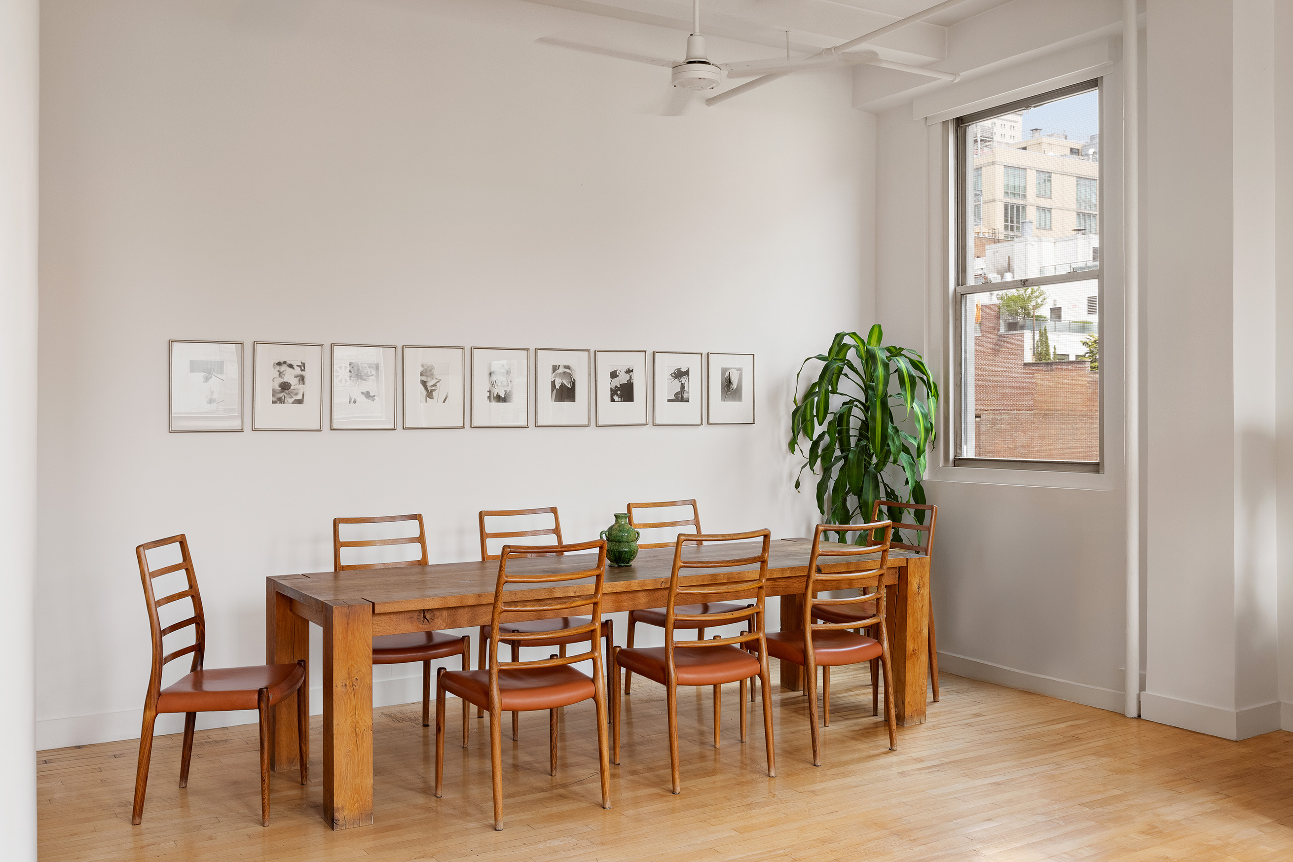 32 West 20th Street, Unit 9B Manhattan, NY 10011 - Photo 6 of 16 a view of a dining room with furniture and a potted plant