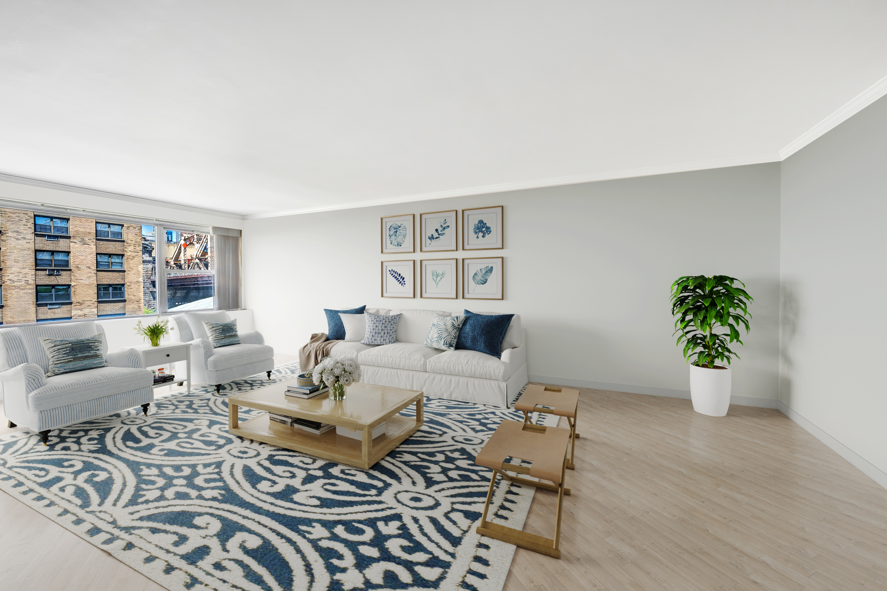 a living room with furniture and a potted plant