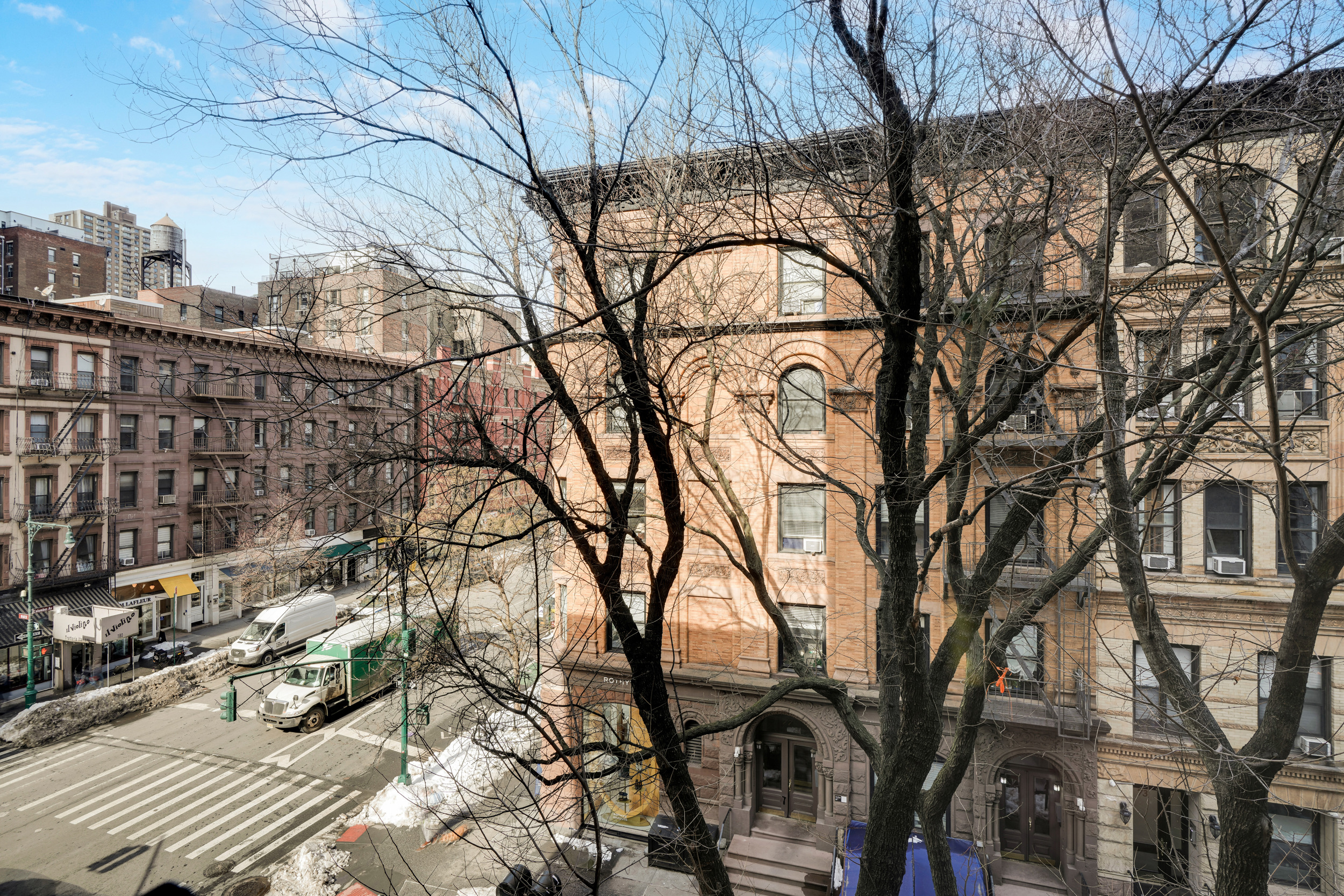 74 West 68th Street, Unit 5A Manhattan, NY 10023 - Photo 24 of 25 a backyard of a house with large trees