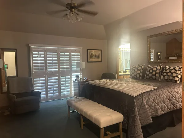 a bedroom with a bed and a couch