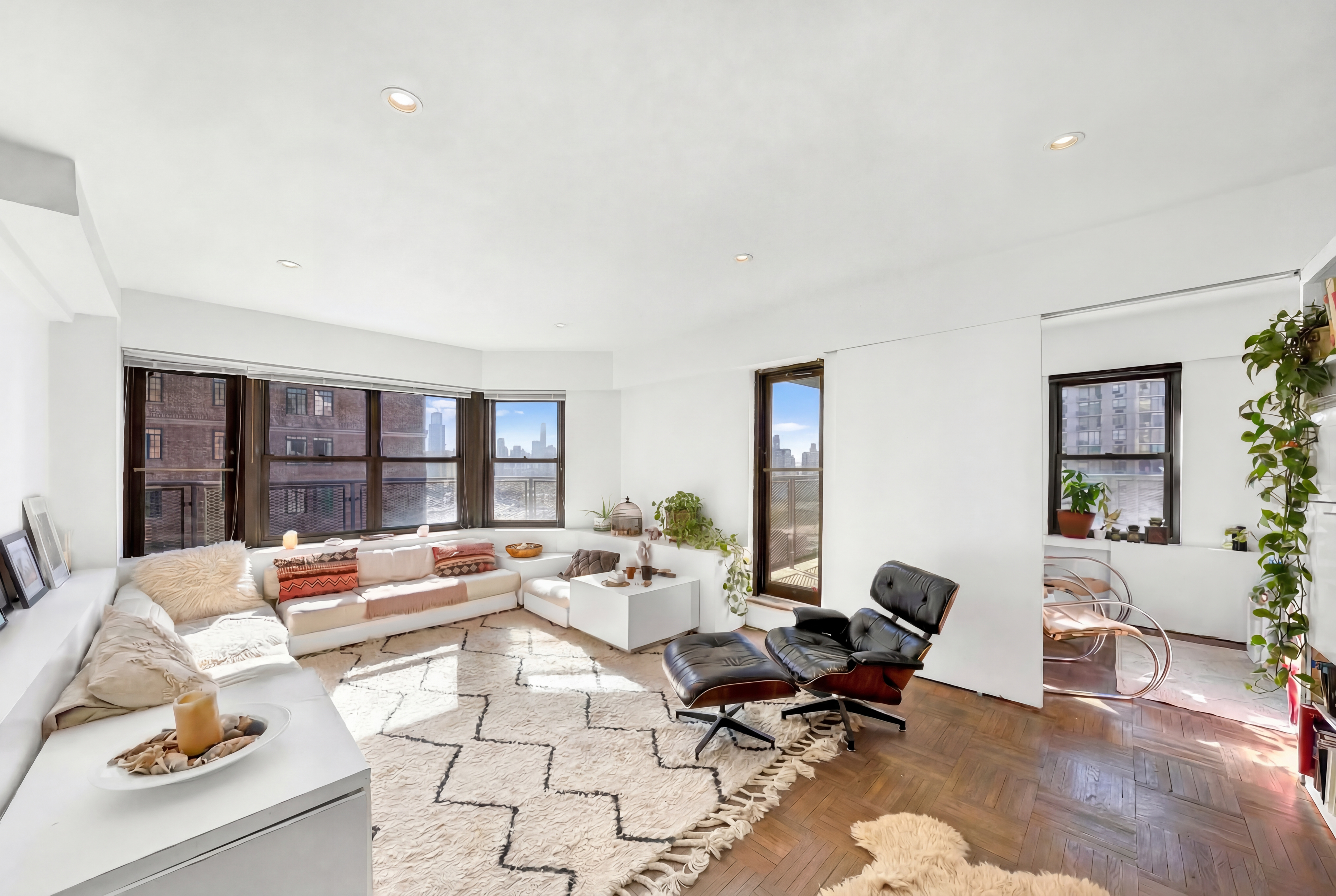 2 Tudor City Place, Unit 15AS Manhattan, NY 10017 - Photo 1 of 17 a living room with furniture and a table