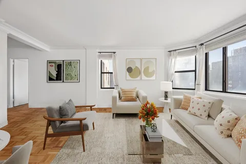 a living room with furniture and windows