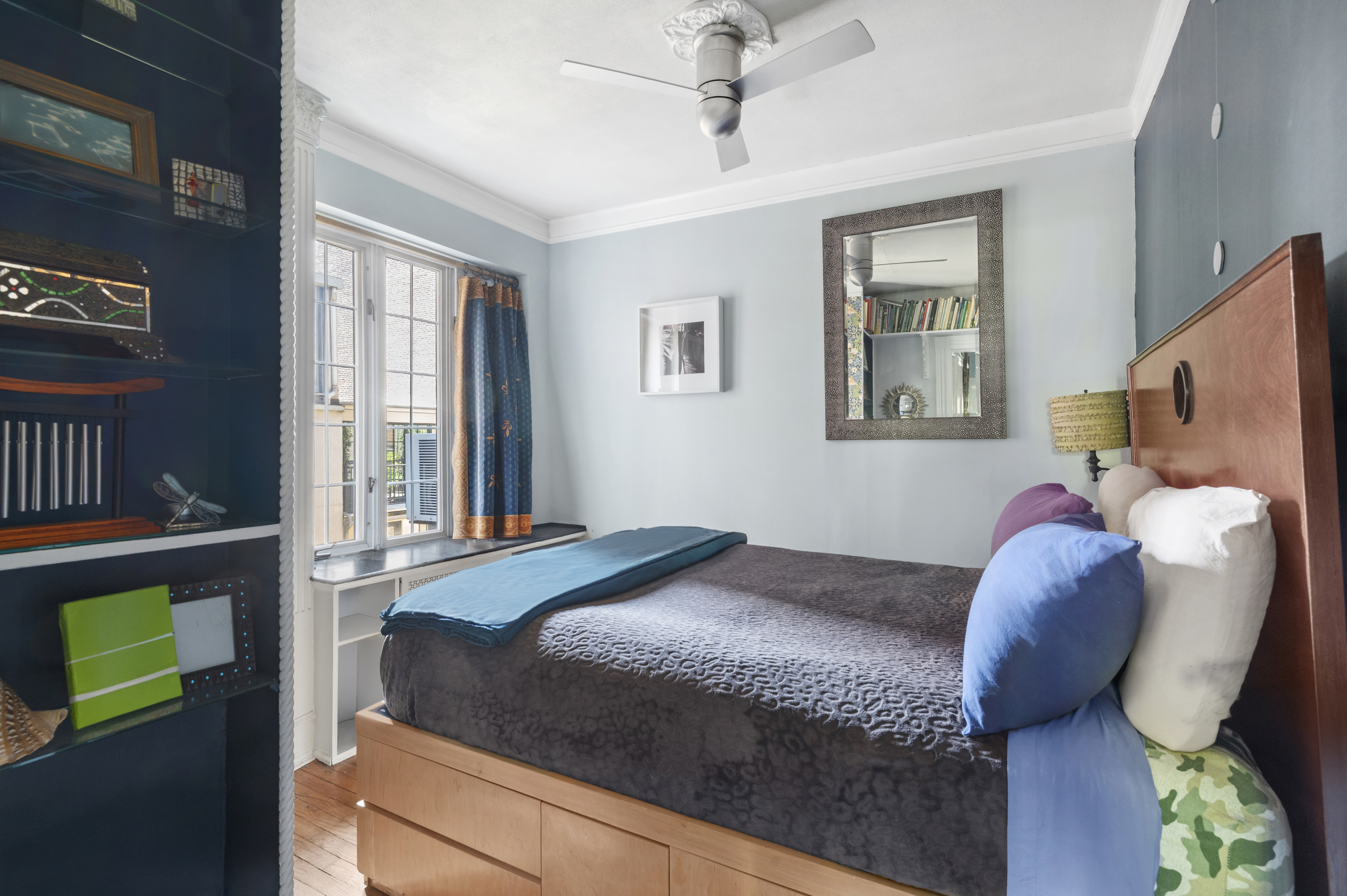 306 West 4th Street, Unit D3 Manhattan, NY 10014 - Photo 5 of 9 a bed sitting in a bedroom next to a window